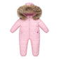 The Baby Wears White Eiderdown Over A Onesie And Down Jacket